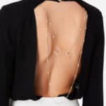 Bodysuit-style blouse with charms on the back