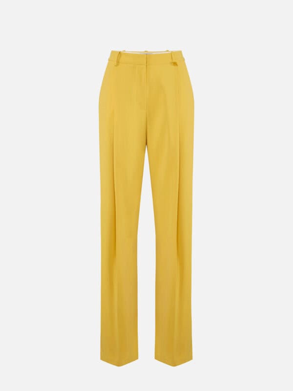 Trousers in lightweight crêpe fabric with logo charm
